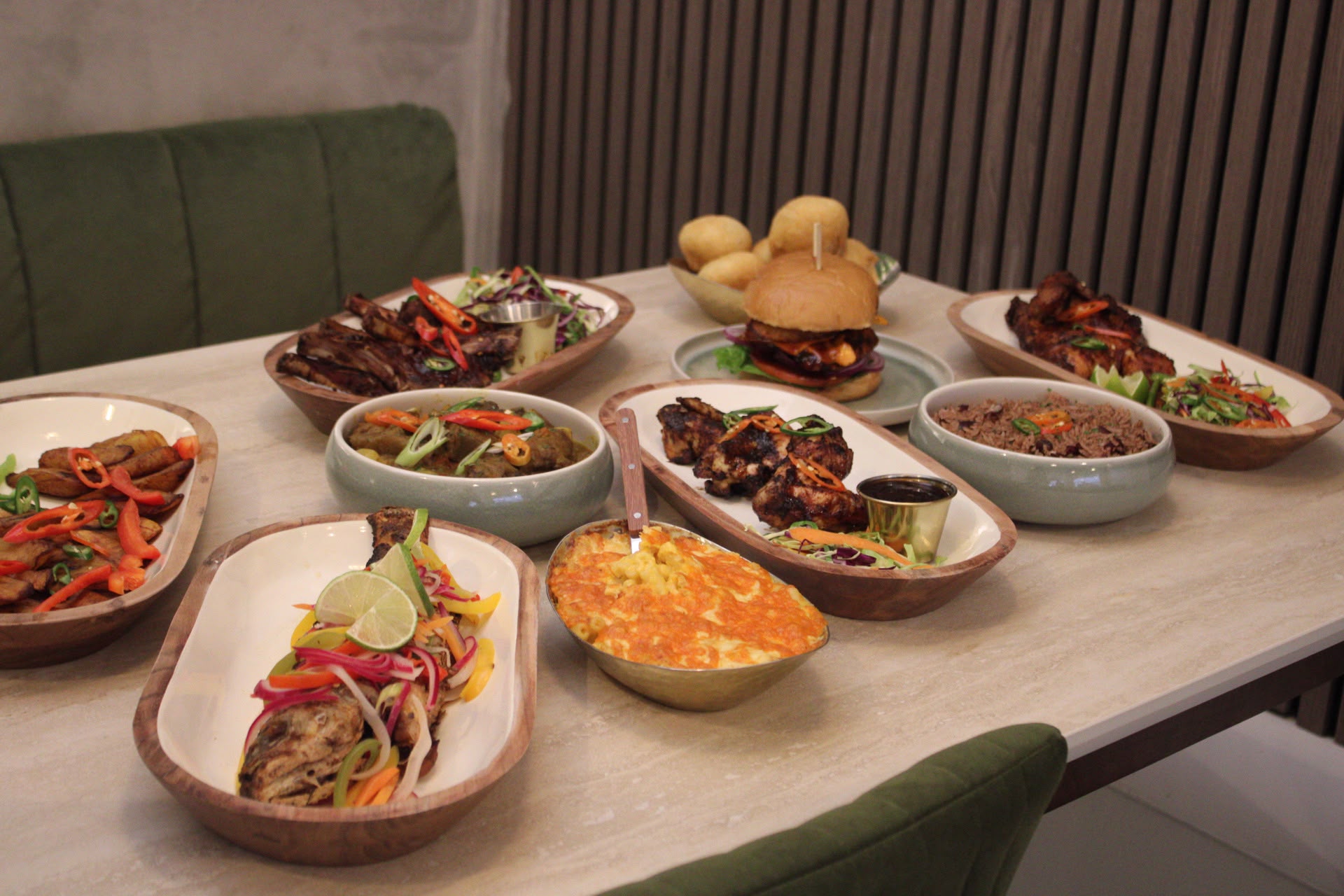 Dining table filled with Hills Kitchen dishes