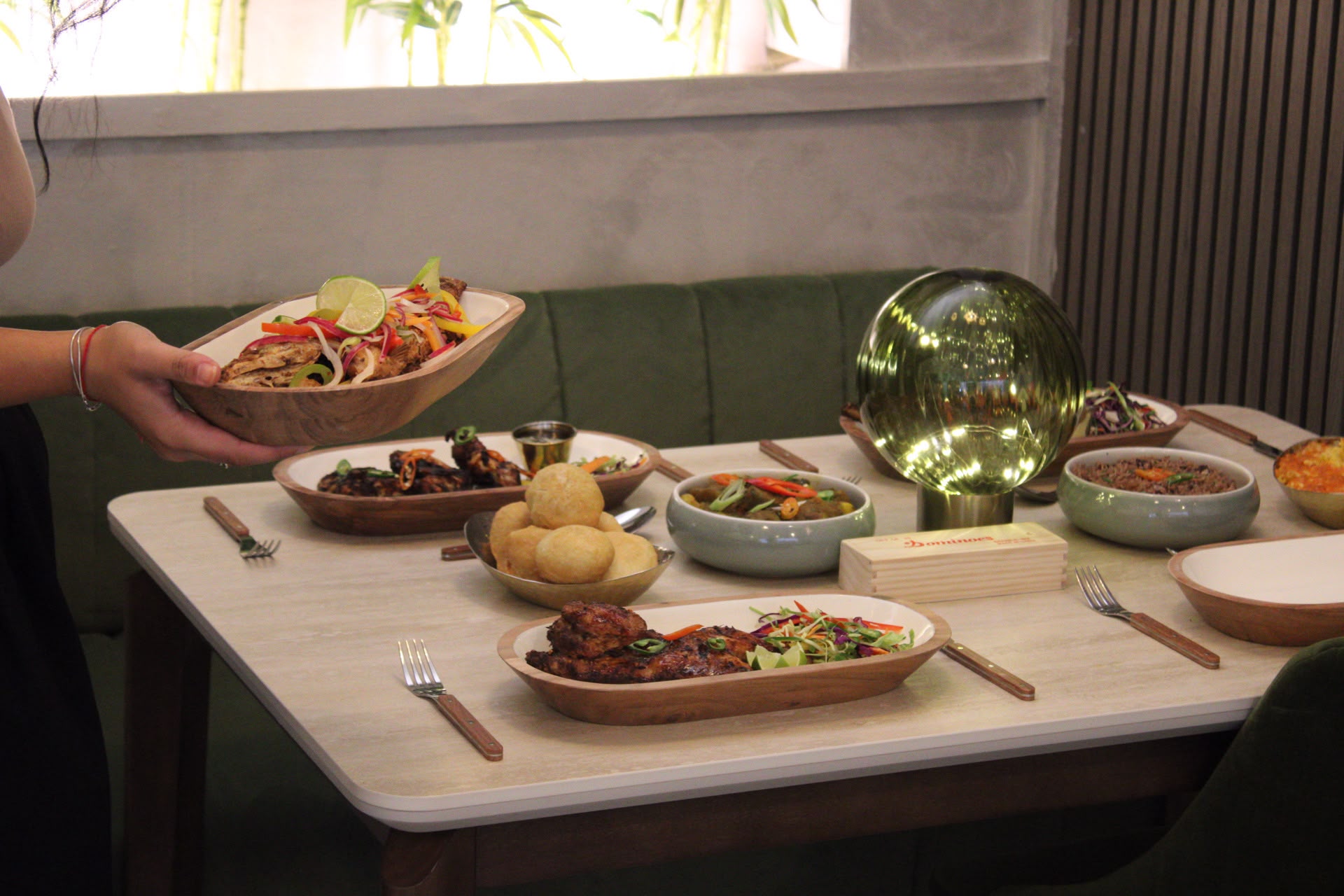 A dish being served inside Hills Kitchen