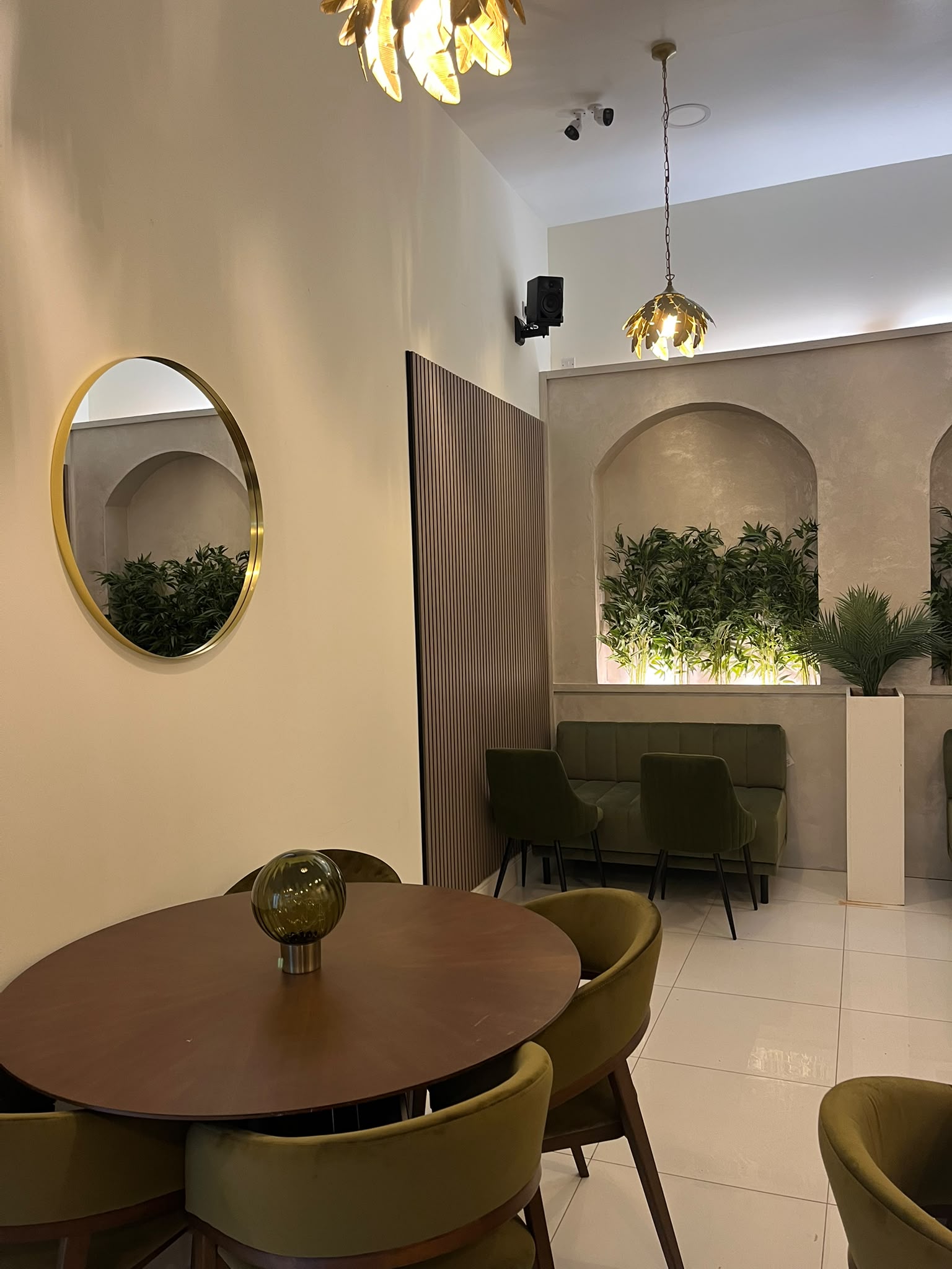 Round dining table and gold lighting
